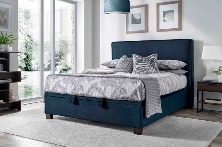 Kaydian ewton Ottoman Bed in Vogue Ocean with patterned bedding in white bedroom.
