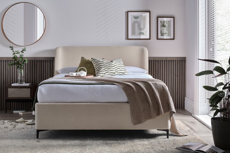 Kaydian Tyndale Ottoman Bed in a Vanilla fabric in bedroom setting