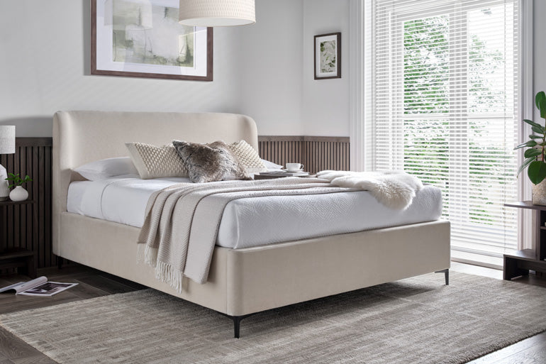 Kaydian Tynedale Ottoman Bed closed in a neutral vanilla colour in bedroom setting
