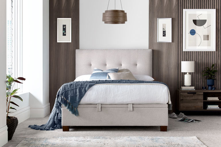 Kaydian Walkworth Ottoman Bed in Maskat Clay and a storage space beneath in a furnished room setting.