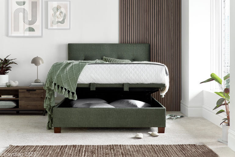 Kaydian Walkworth Ottoman Bed in Moss Green with storage compartment open.