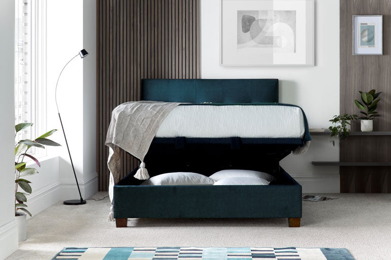 Kaydian Walkworth Ottoman Bed in Ocean Blue with storage open in modern bedroom.