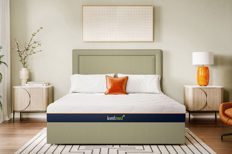 Bed with a Komfi Med Ortho Mattress in a bedroom setting