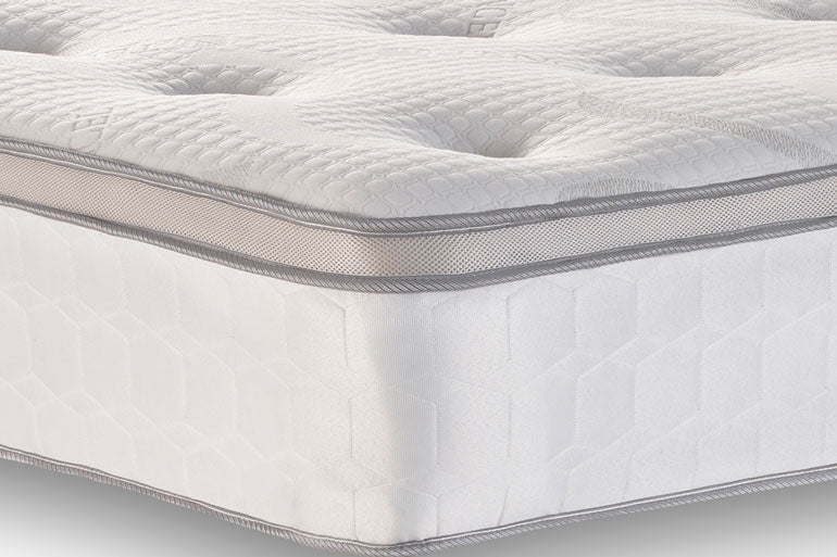 Close-up of a Memory Pillow Top mattress with a textured surface and visible stitching.