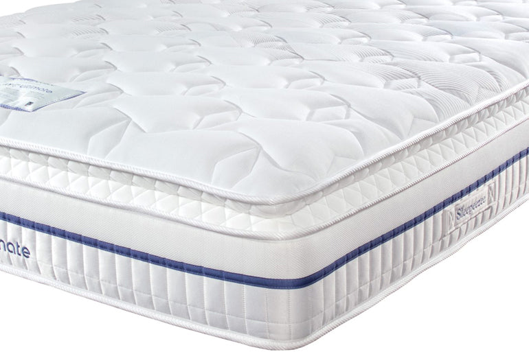 White mattress with blue stitching on a white background