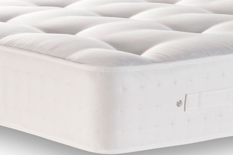 Close-up of a Natural Wool 1000 Mattress on a white background.