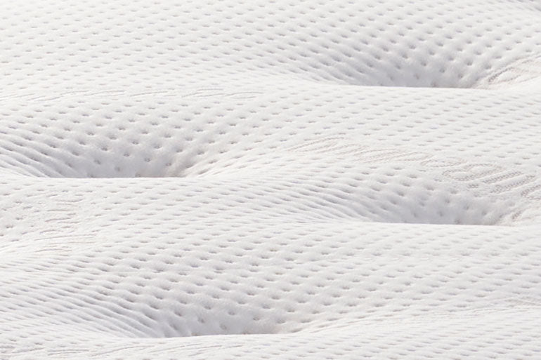 Close-up of a textured white fabric surface