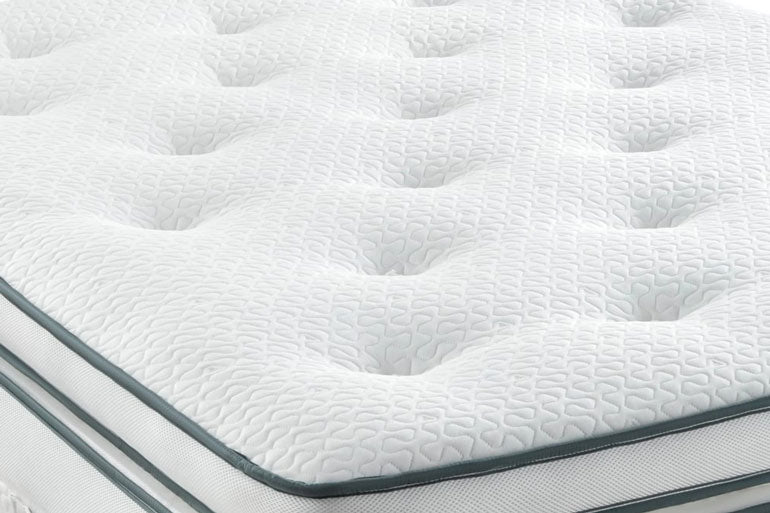 Close-up of a white mattress with a textured surface