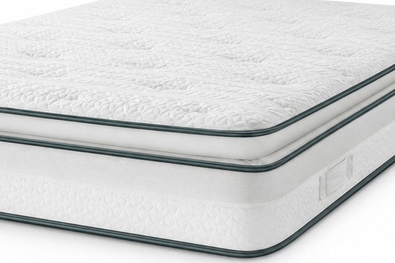 Close-up of a white mattress with a textured surface on a white background.