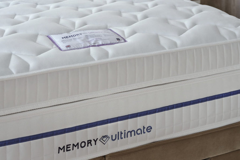 Memory ultimate mattress with visible branding on a divan bed base.