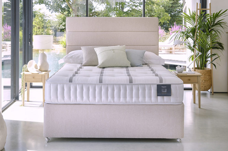 Divan bed with Sleepeezee Ortho Bespoke Bronze Mattress on it in bedroom setting