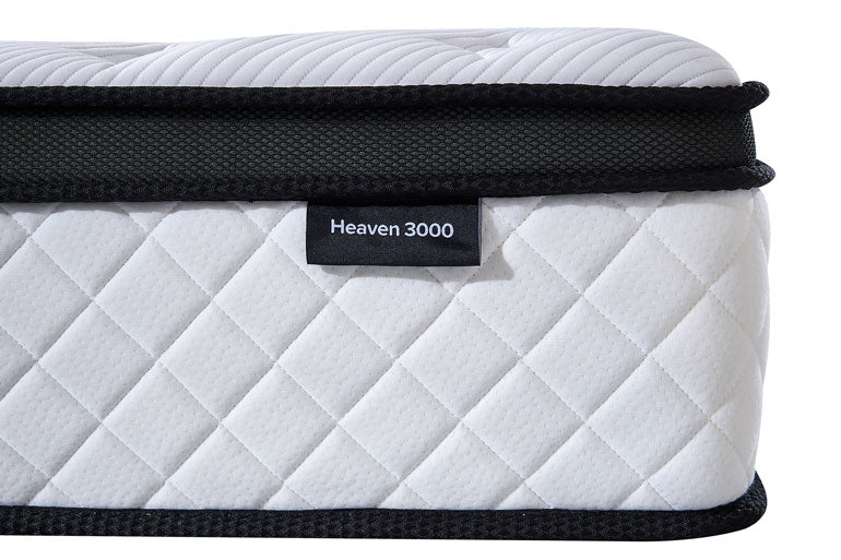 Close-up of side of Heaven 3000 mattress on a white background