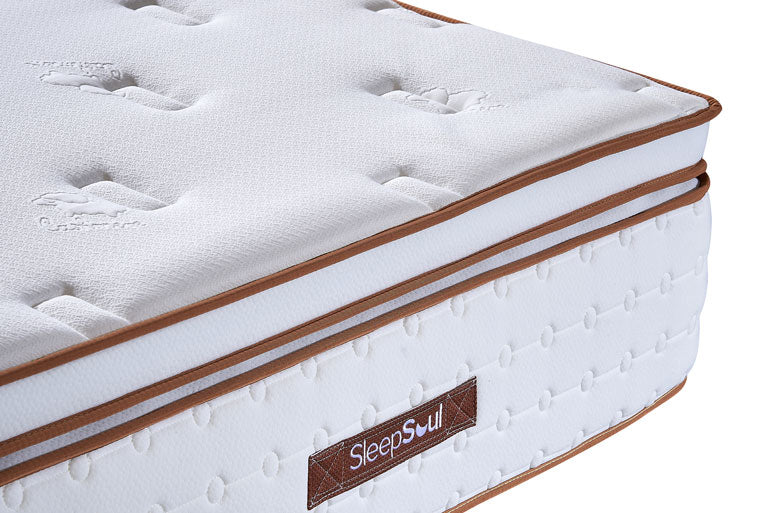 Close-up of corner of pillow-top space 3000 mattress on white background