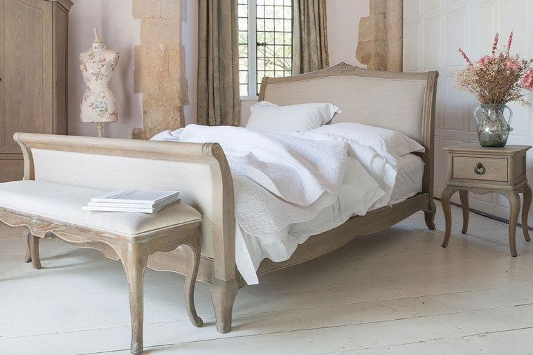 Willis &amp; Gambier Camille High Foot End Bed in a bedroom with a bench and side table.