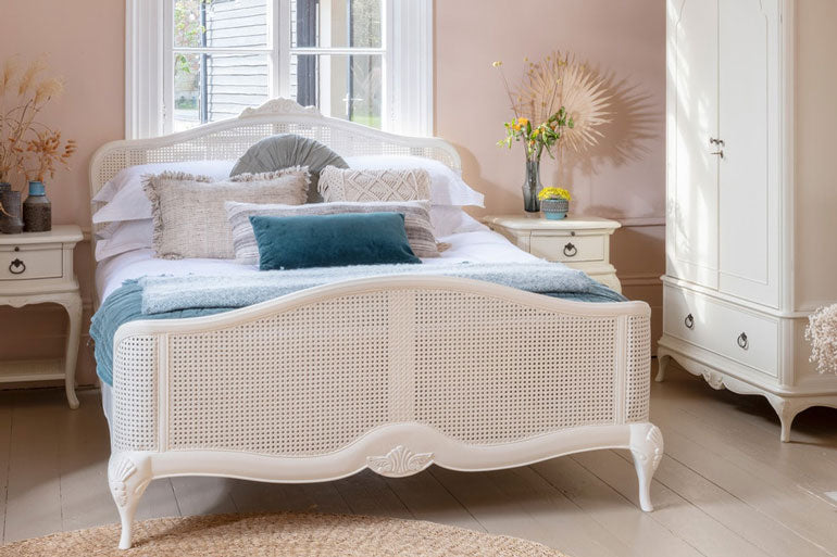 Willis &amp; Gambier Ivory Rattan Bed in bedroom setting.