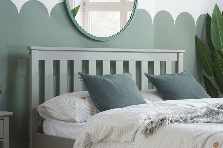 Close-up of Denver Bed in Grey against green bedroom wall
