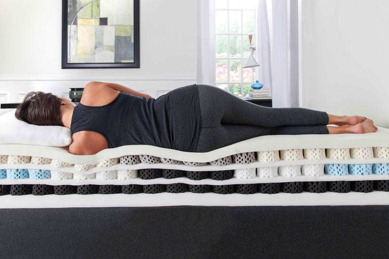 Woman laid on side of a Dormeo Octaspring 9500 Latex Memory Foam Mattress
