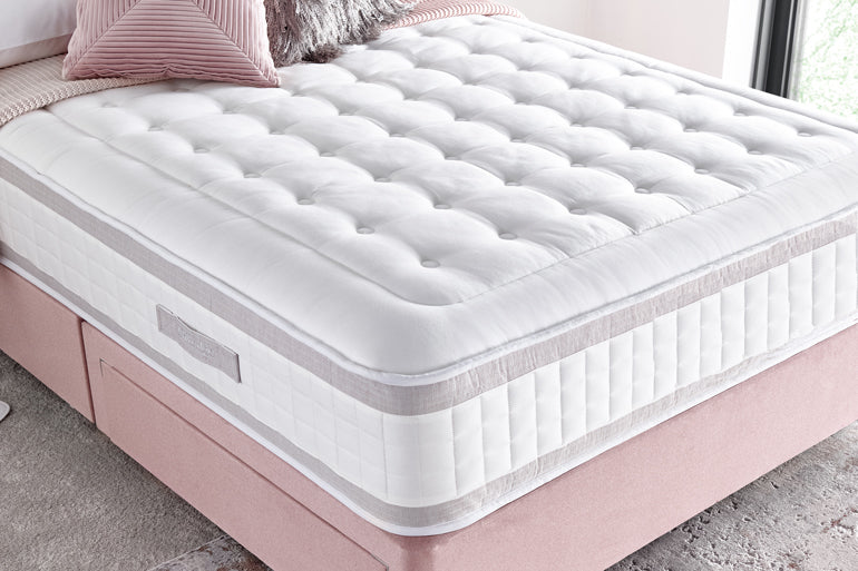 Giltedge Shine 2000 pocket sprung mattress on pink divan base in bedroom setting