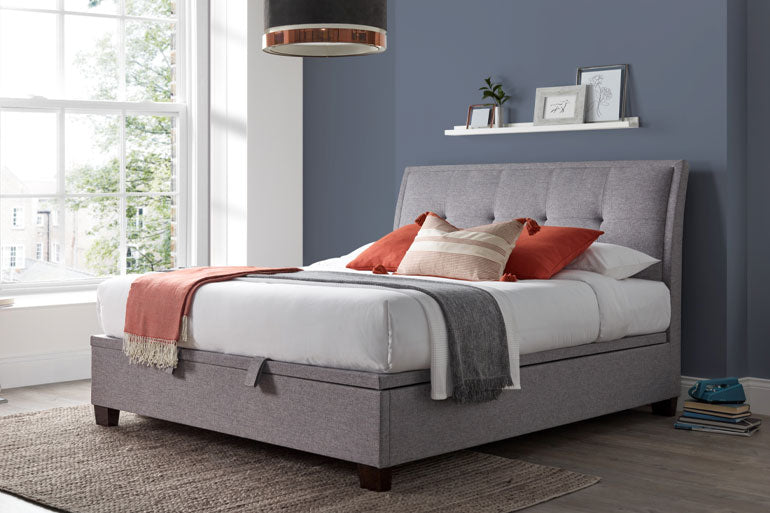 Kaydian Accent Ottoman Bed in Marbella Grey in bedroom.