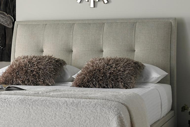 Close-up of Kaydian Accent Ottoman Headboard in Oatmeal.