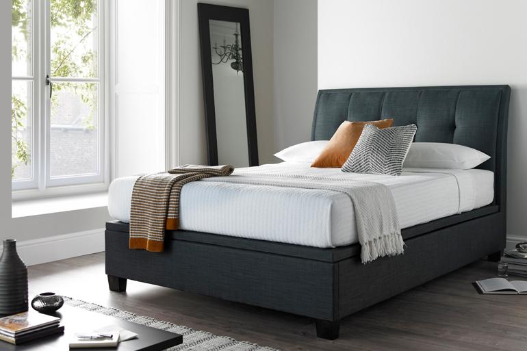 Kaydian Accent Slate Ottoman Bed in bright white bedroom. 