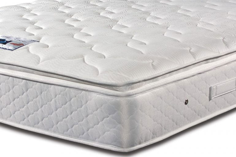 A corner view of a white Sleepeezee Memory Comfort 1000 mattress with a quilted design on the surface.
